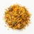 Loose dried calendula flowers on a warm-white background.