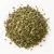 Loose dried oregano on a warm-white background.