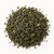 Loose dried peppermint leaf on a warm-white background.