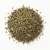 Loose dried hyssop herb on a warm-white background.