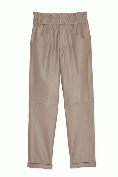 Front view of Max & Moi leather pant. These pants are with an elastic looking band, with snap button closure and 2 pockets. Front view of Max & Moi leather pant. These pants are with an elastic looking band, with snap button closure and 2 pockets.