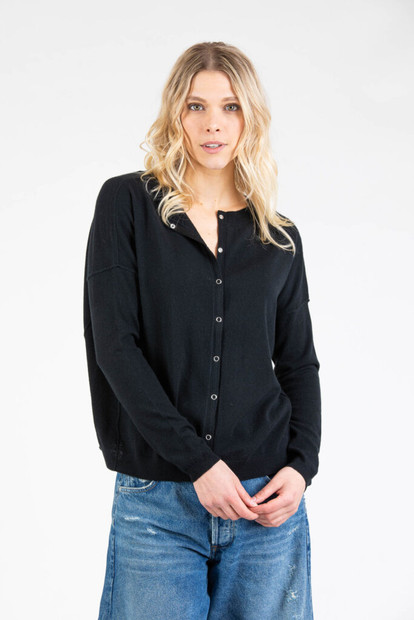 Front view of Paychi Guh. cardigan. This cardigan is a crew neck with button down closure, drop shoulder, and relaxed fit. Front view of Paychi Guh. cardigan. This cardigan is a crew neck with button down closure, drop shoulder, and relaxed fit.