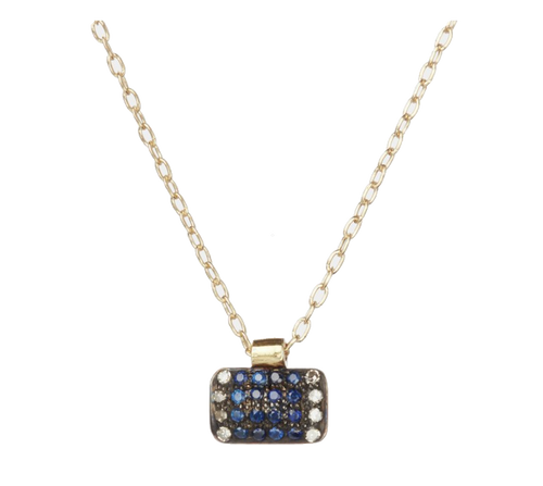 View of 5 Octobre necklace. This necklace is with 24k gold vermeil, diamonds, sapphire, and oxidized silver