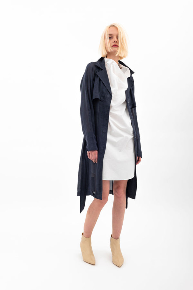 A fresh take on a classic silhouette, this versatile trench is done in luxe sheer ramie. Wear it open or closed, over a dresses or coordinated ensemble - it will always be effortlessly chic!

Trench coat with snap front closure, and waist tie
54% Viscose, 46% Ramie
Gentle wash with like colors and air dry, or dry clean
Imported
Model is 5'8 and wears a size small