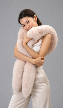 Beige Fox Tail Fur Scarf  Beige Fox Tail Fur Scarf Width: 3 Inches Length:  60 Inches Color shown: Pink Fur Origin: Norway Manufactured: USA