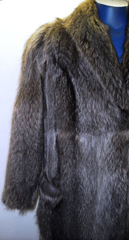 Full Skin Vintage Raccoon Ladies Raccoon vintage Fur coat Stand Up Collar Straight Sleeves Size: Large Light, Very Warm and Comfortable Hook and Eye Closure Fur Origin: USA Manufacturing: USA Vintage is a Pre-Owned Or Estate Piece One Of a kind, From Our Fur Collections Shoulder To Shoulder: 20" Inside Cross back:17" Collar to Bottom:47" Sweep:50" Neck to Sleeve: 31"