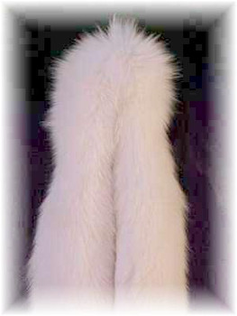 White Fox Fur Scarf  Full Skin Fox Fur Scarf Width: ~4" Length: ~80" Padded Grosgrain Lining Fur Origin: Norway Manufacturing: USA