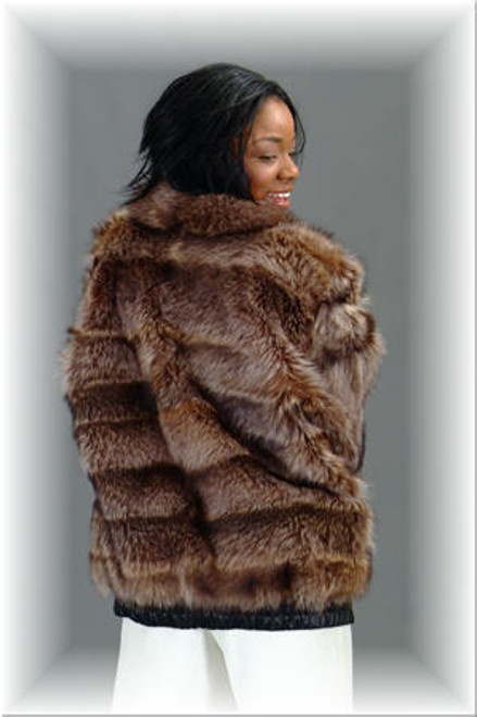 Raccoon Fur Bomber Jacket with Small Wing Fur Collar Raccoon Bomber Fur Jacket Full Skin Leather on Cuffs and Elastic Leather Trim on Bottom of Jacket Length 28 1/2" Sleeve Length 32 1/2" Color Shown Is Natural Raccoon Zipper Closure Fur Origin: USA Manufacturing: USA