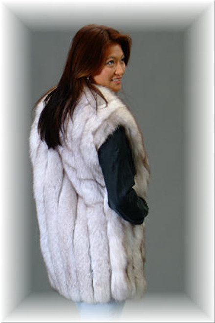 Natural Blue Fox Fur Vest  Blue Fox Fur Vest Length: 25 Inches Genuine Fox Fur Hook & Eye Closure Fur Origin: Norway Manufactured: USA