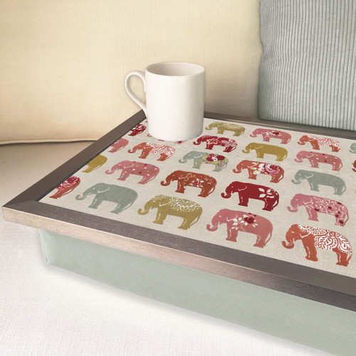 elephant lap tray with silver frame and green cushion on a sofa