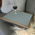 Trellis 08 turquoise lap tray with silver frame shown with a wine glass on top