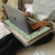 blithe green lap tray with silver frame with a woman using a laptop