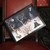 winter woodland animal lap tray with a black frame pictured on a red chair