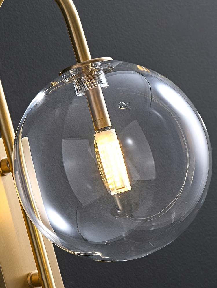 Lacros Brass Curved Arm Clear Glass Wall Light - Zest Lighting