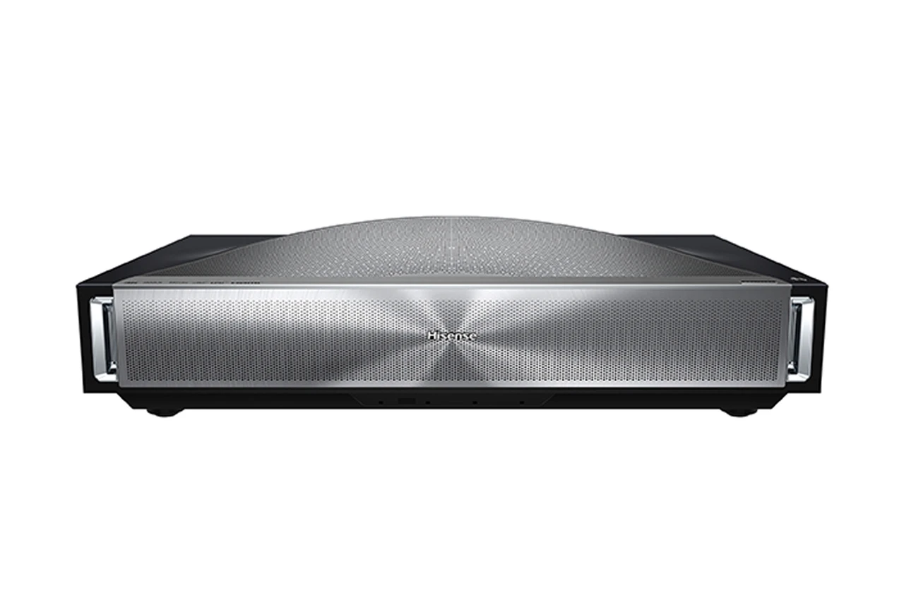 An ultra-short-throw laser projector on a media unit, projecting a large image onto a wall behind it.