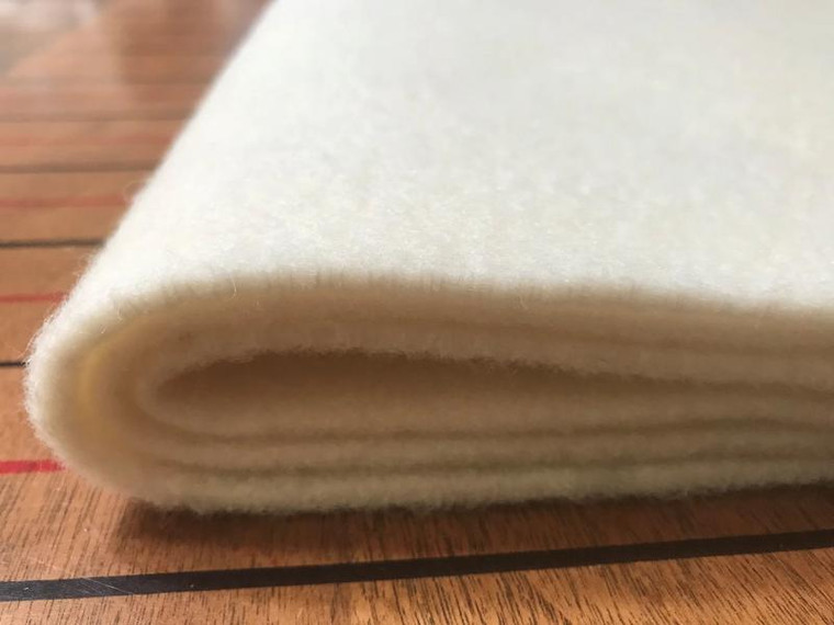They work great in between the mattress and wooden slats to keep moisture away from your mattress (in place of a Bed Rug).
Our Organic Wool, is loosely felted into an almost 1/4" thick insulator pad.