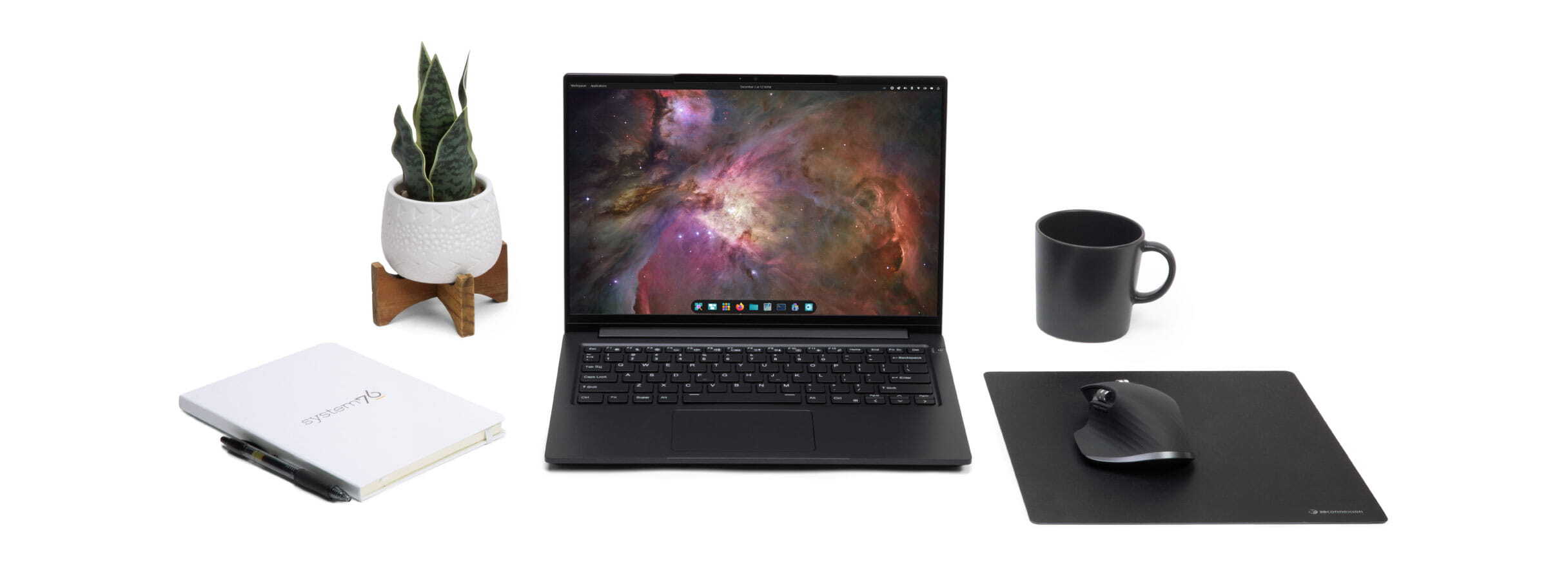 Linux laptop on desk with display featuring Pop!_OS