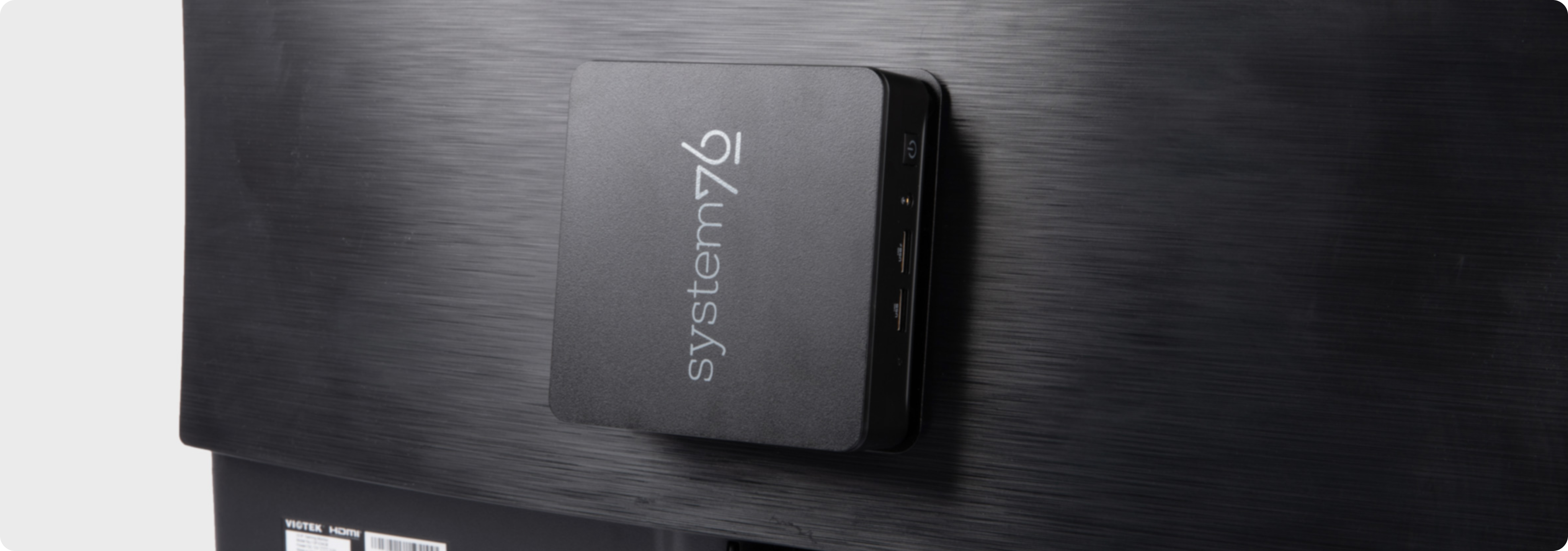 meerkat mounted on a vesa mount on the back of a display monitor