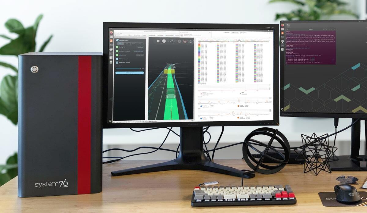 Thelio Astra with a red accent panel  displayed in a room with red decor