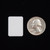 Individual 3/4" x 1" Rounded Edge Rectangular Self Adhesive Plain Label next to a U.S. Quarter