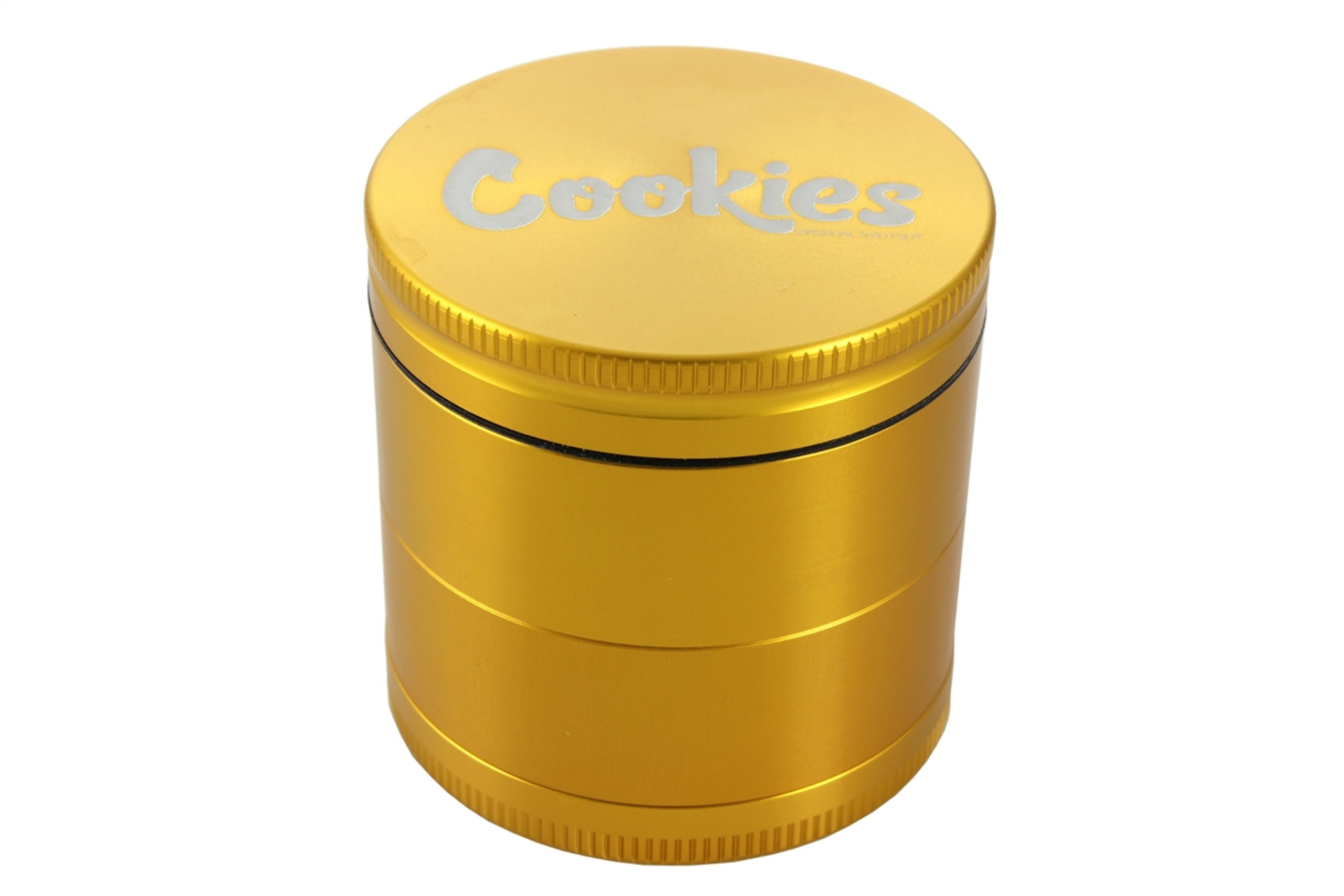 Gold four piece Cookies grinder