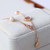 Tory Burch Delicate Pearl Crystal Logo Bracelet - Rose Gold