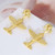 Tory Burch Gold Airplane T Logo Drop Earrings