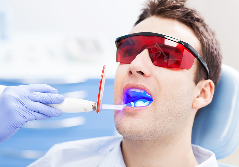 The Effects of Light on Bleaching And Tooth Sensitivity