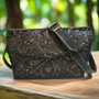 Black leather bag for women with hand carved floral design