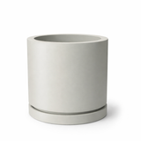 Round Marek planter shown in dove grey with drip tray