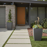 Rocca Fiberglass Tapered Square Planter next to a front entrance way