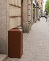 Tetra Modern 17.75" Square x 36" Height Fiberglass Trash Receptacle beside a commercial building sidewalk in a major city Tetra Modern 17.75" Square x 36" Height Fiberglass Trash Receptacle beside a commercial building sidewalk in a major city
