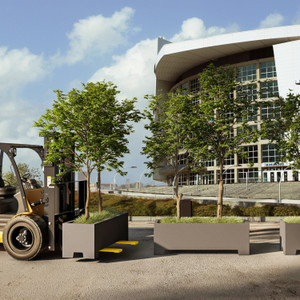 Modern fiberglass planter with forklift knockouts being lifted with a forklift. Modern fiberglass planter with forklift knockouts being lifted with a forklift.
