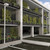 Wall planters with mounted trellis on a parking structure.