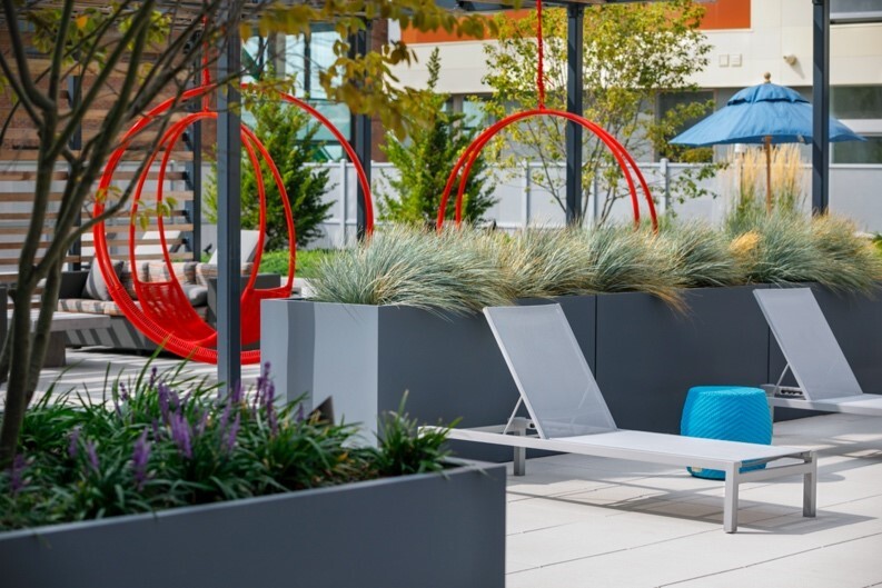 Hotel planters featured in an outdoor lounge area