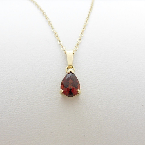 9ct yellow gold pear shaped garnet pendant on 20" chain