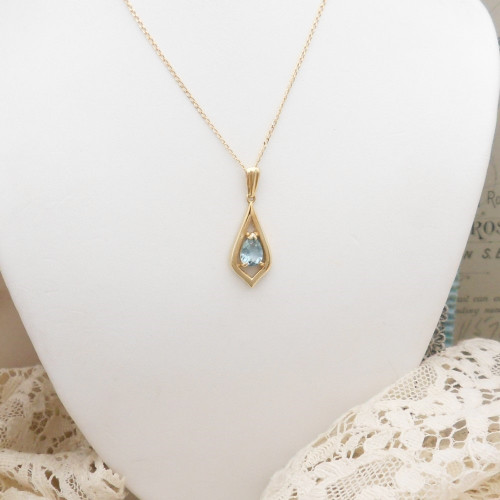 9ct yellow gold topaz set pendant on 16" fine chain marked 9kt