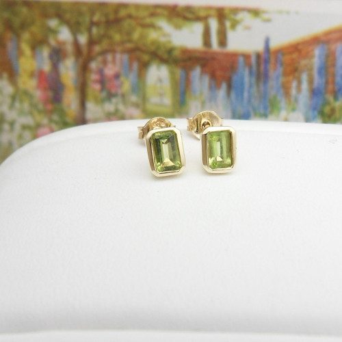 Pair of 9ct yellow gold rectangular peridot stud earrings