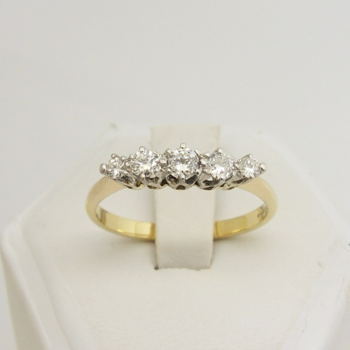 Diamond set five stone ring marked 18ct Size O