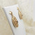 Pair of ornate 9ct gold garnet set earrings