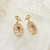 Pair of ornate 9ct gold garnet set earrings