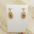 Pair of ornate 9ct gold garnet set earrings