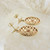 Pair of ornate 9ct gold garnet set earrings
