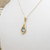 9ct yellow gold topaz set pendant on 16" fine chain marked 9kt