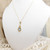 9ct yellow gold topaz set pendant on 16" fine chain marked 9kt