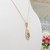 9ct yellow gold topaz set pendant on 16" fine chain marked 9kt