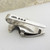 Edwardian silver shield design napkin clip