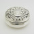 Beautifully embossed circular silver pill pot with gilt interior