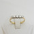 Diamond set five stone ring marked 18ct Size O