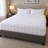 Martex Down Alternative Flex Blanket tucked on a bed